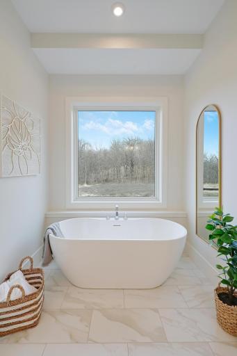 The deep soaking tub with a private view.