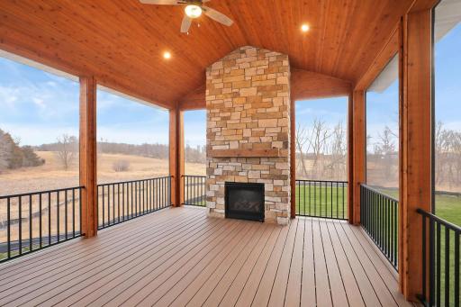 The screened-in porch is a delight for enjoying the outdoors. The gas fireplace extends the season.