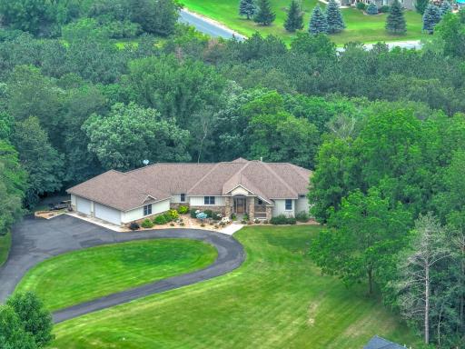 Situated on nearly 2 acres in a quiet neighborhood, enjoy a private, spacious yard, generous screened porch, walkout deck, & beautiful landscaping. Attached, 6-car heated garage w/ 3 stalls on each level connected by a paved driveway & access doors.