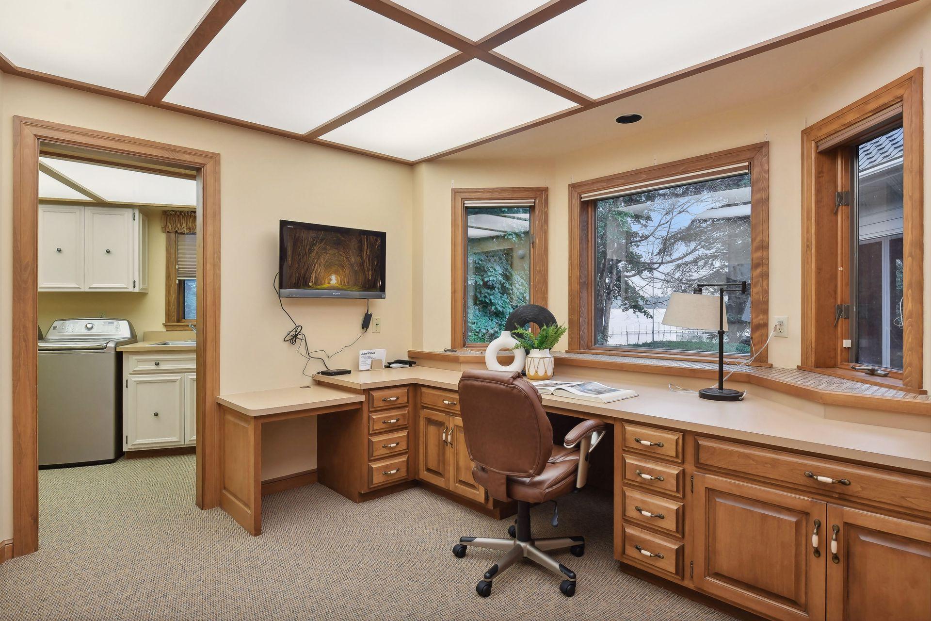 Main floor office with built in desk.