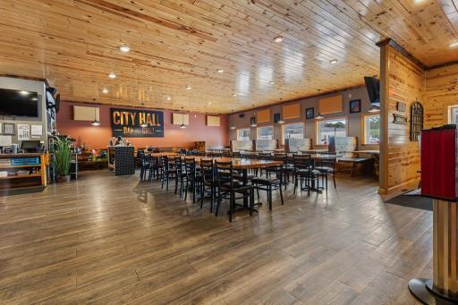 Looking for your next business venture? An impressive remodeled interior boasts a warm, inviting atmosphere with wood plank ceilings, recessed lighting, and luxury vinyl plank flooring