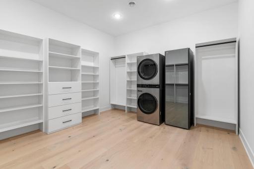 Primary Walk In Closet+ washer/ dryer & steam closet
