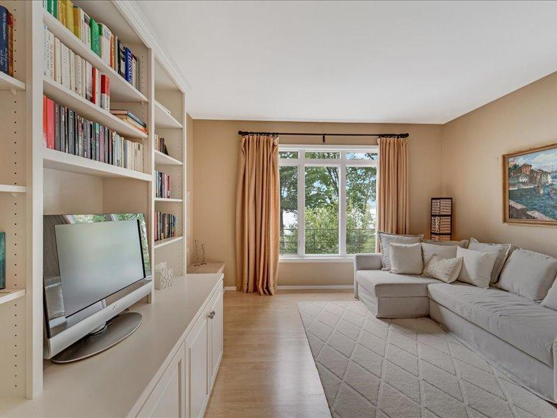 Main floor office/guest room with lake views, and built-ins.