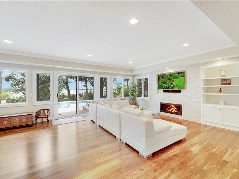 Lower level family room, walkout to the pool, lake views, open and modern.