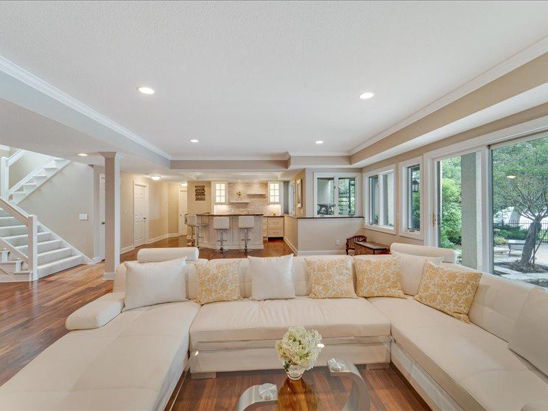 Lower level family room flows into the wet bar.