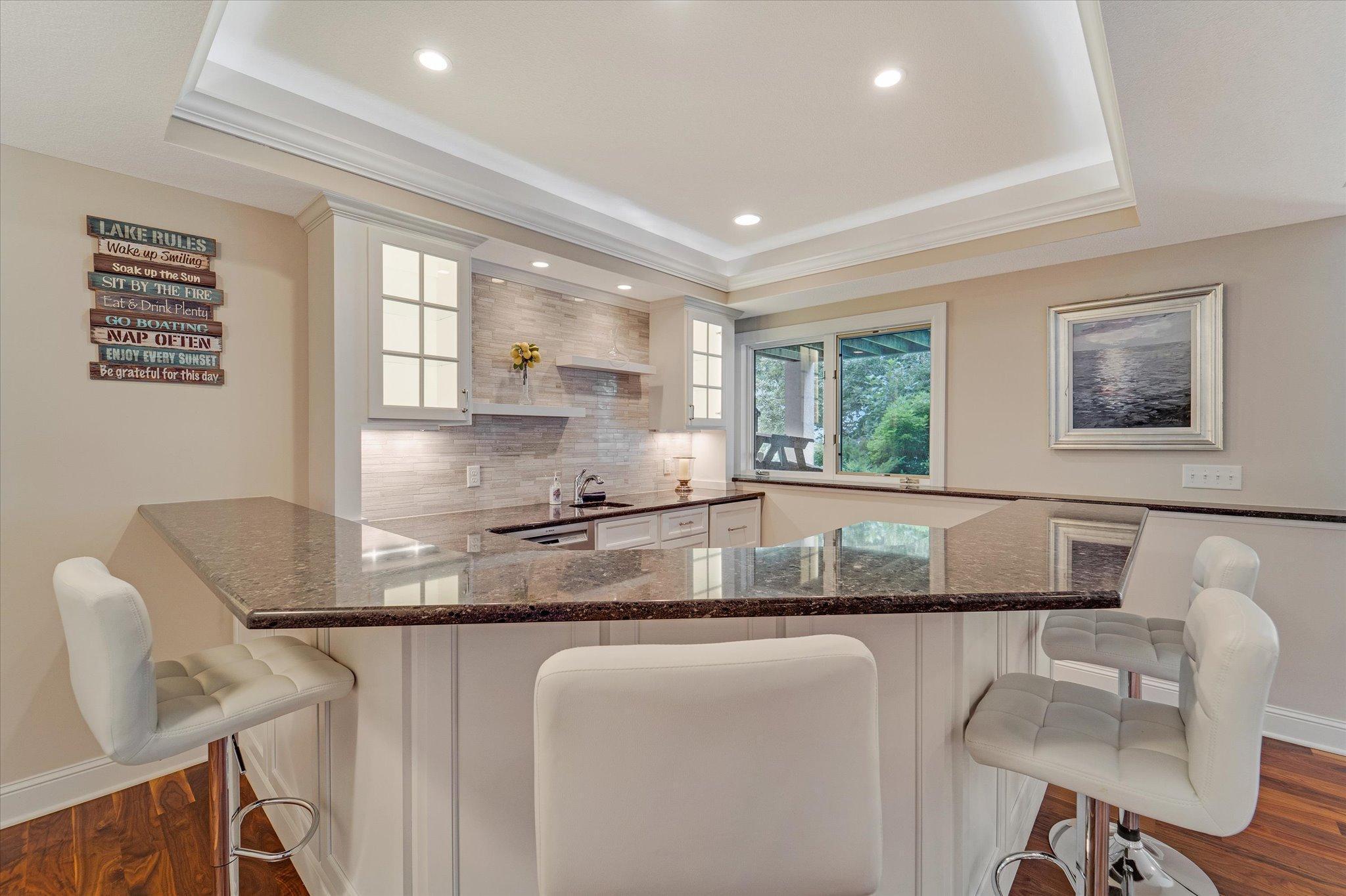 Lower level wet bar, wine fridge, cooler/fridge , dishwasher