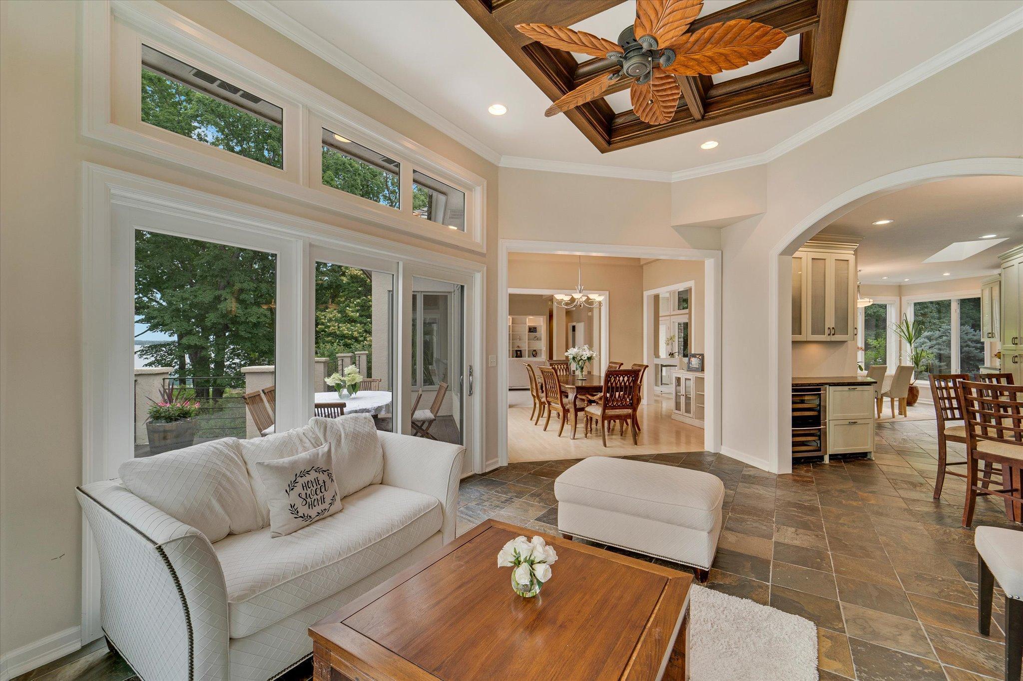 Sun room, kitchen and formal dining room all flow with huge windows and tall ceilings, the perfect place to entertain.
