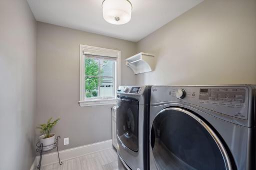 Main floor laundry room with laundry sink, too!