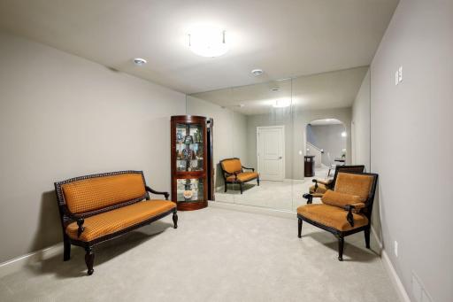 The back wall mirrors make this a great area to use for a fitness room!