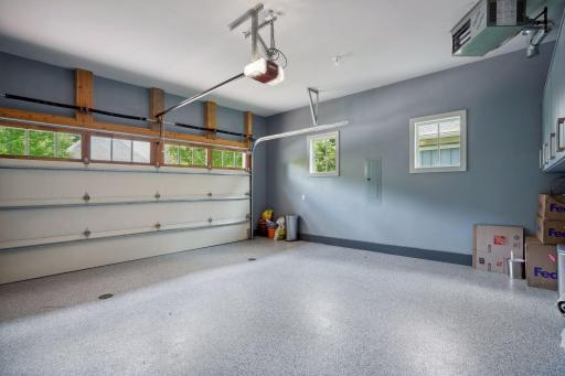 Even the garage is a wow! Epoxy floors, heater, cabinet and tool space, floor drains and water access