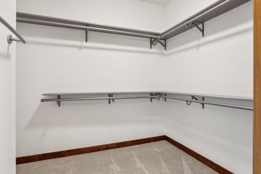 One of the two primary suite walk-in closets.
