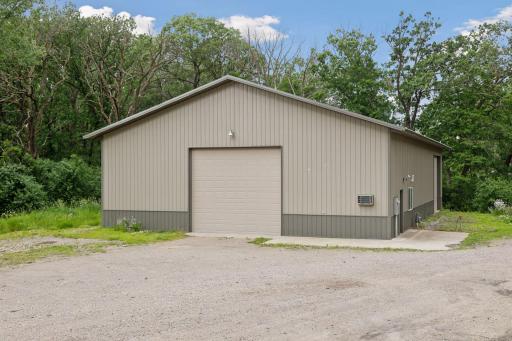 Outbuilding is 50' x 80' complete with concrete floors, lots of lighting and two 14-foot overhead doors.