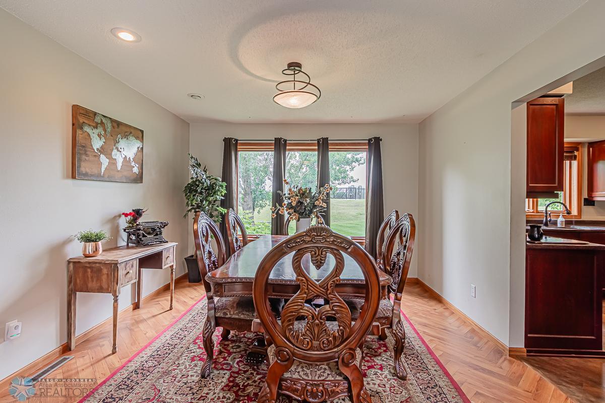 Formal Dining Room with Herringbone Wood Floors