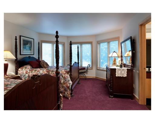 This is one of two bedrooms in the lower level of the Mary Hill Lodge, with views of the lake