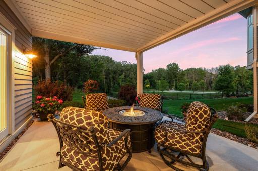 The patio overlooks a private and wooded backyard.