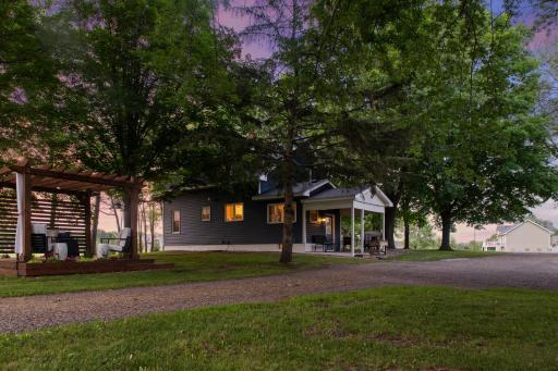 Acreage, outbuildings, flat land and COMPLETELY updated home!
