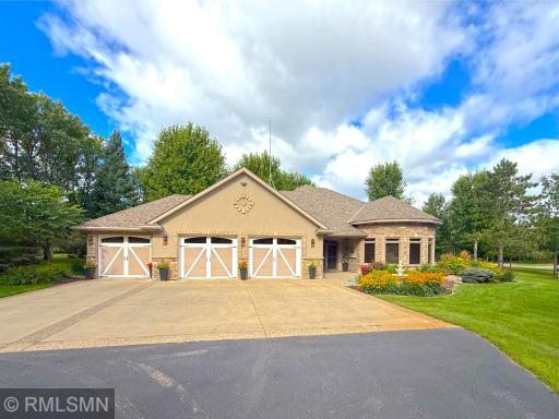 With its majestic, towering trees, this custom home looks and feels like your own private forest sanctuary with immaculate landscaping.