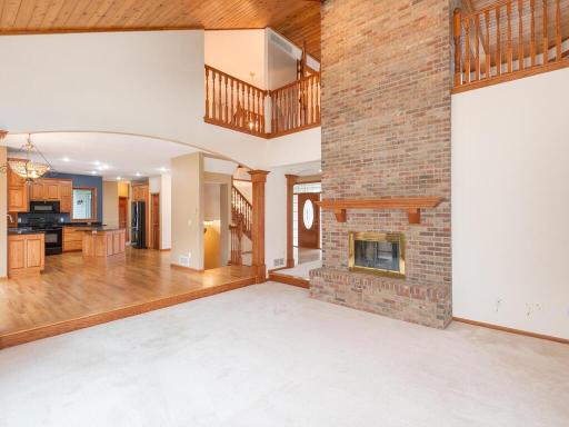 Great Room opens to Kitchen/Dining area and to Loft above.