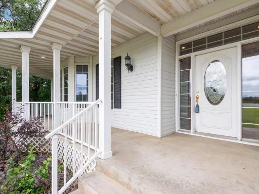 Wrap-around covered Front Porch welcomes guests!