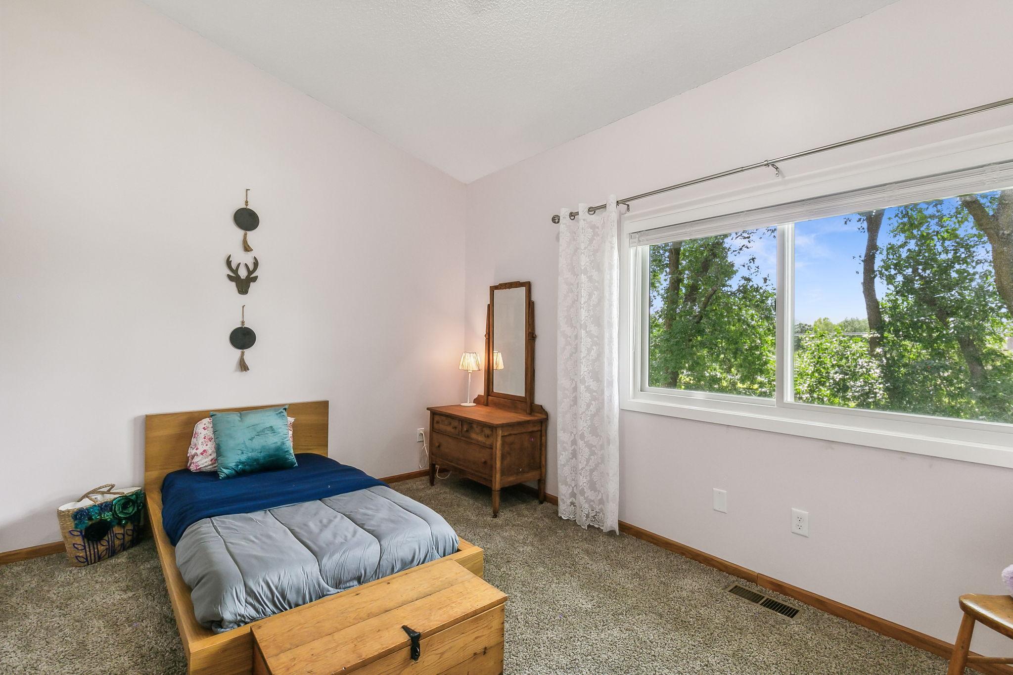 2nd spacious bedroom with vaulted ceiling.