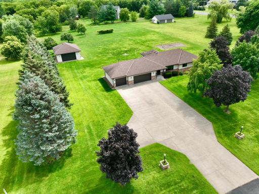 This immaculate home is situated on generous over 2 acre lot offers privacy & peace season after season