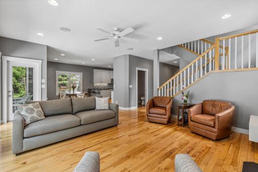 Another view of the living room with hickory floors