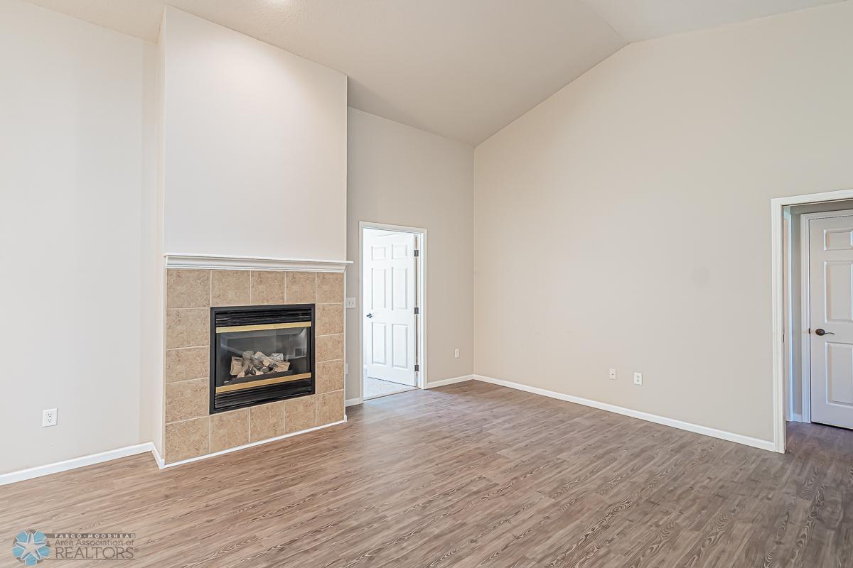 Gas Fireplace in Living room and access to the primary bedroom