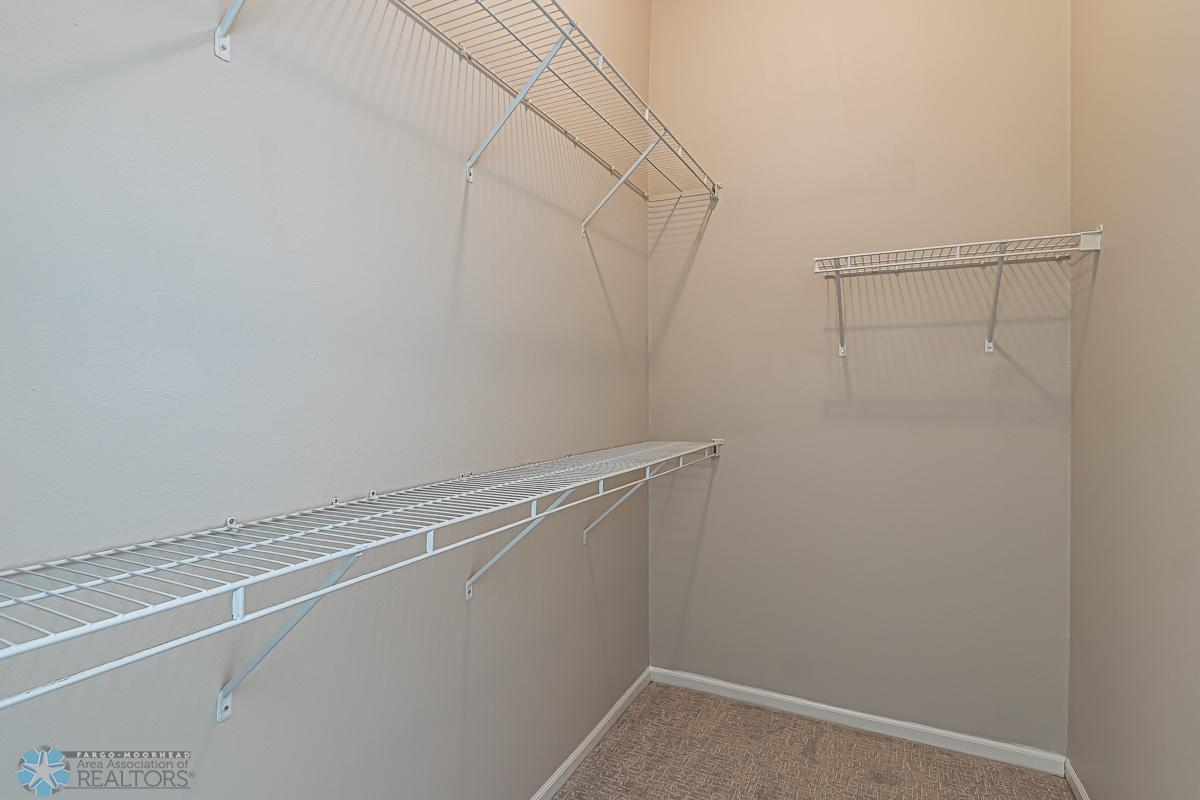 Primary bedroom walk in closet