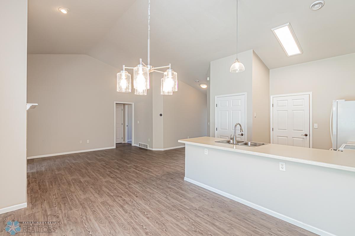 view from dining room to foyer and 2nd bedroom and bath hallway