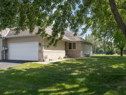 End unit townhome with great curb appeal-lots of greenery space around this lovely townhome. One level with finished lower level. Main floor has 2 bedrooms 2 baths, kitchen and laundry-can do all your living on the main floor.