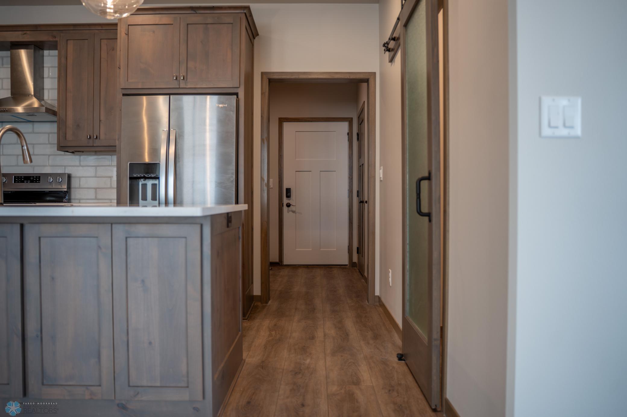 Back entry with laundry and additional storage room.
