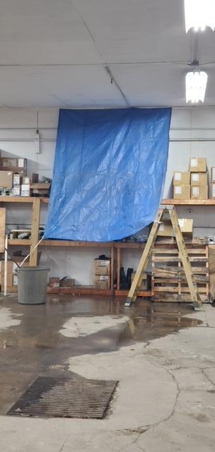 Water leaking from the ceiling in the shop.JPG