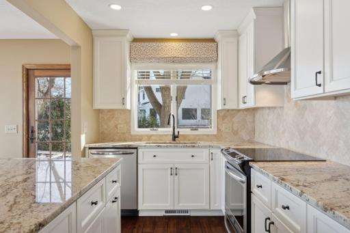 Enameled cabinets, granite and stainless
