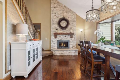 Soaring 2 story ceilings, hardwood floors and gas fireplace