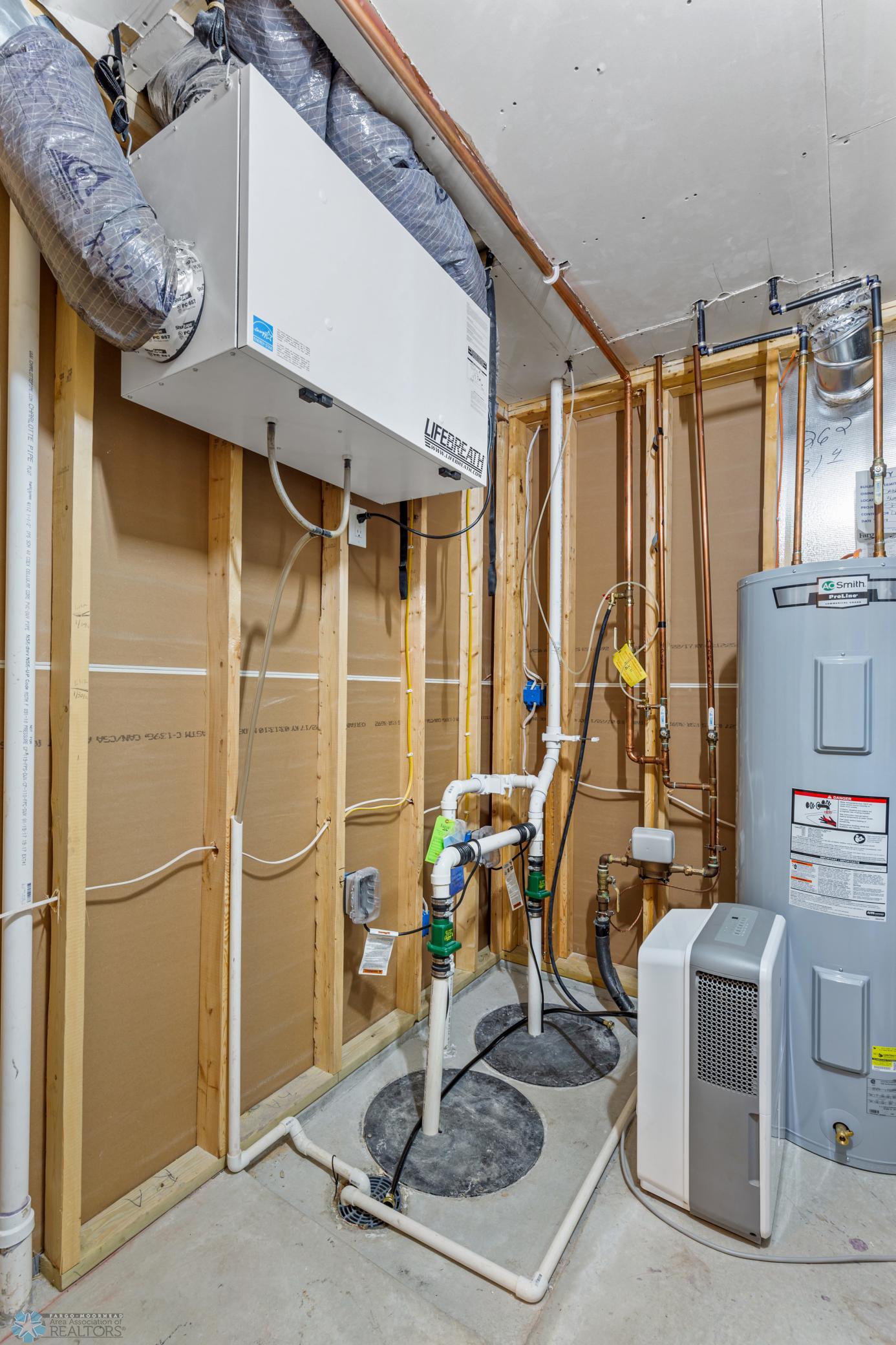 Utility Room - Air Exchanger & 2 Sump Pits