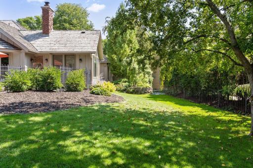 Backyard can be accessed from the pool area or a convenient garage service door
