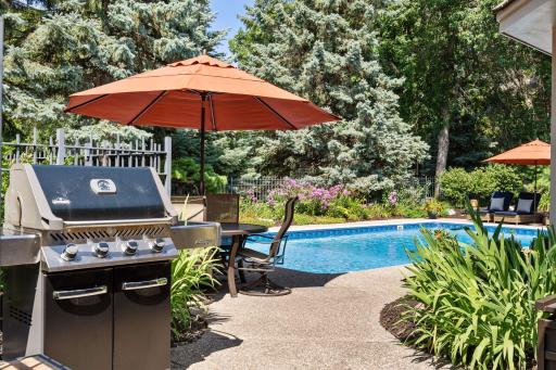 Grilling area just outside the sunroom entrance makes outdoor entertainment easy