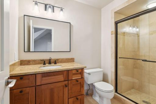 Upper level suite features a 3/4 bath and large walk-in closet