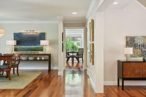 Gorgeous Brazilian hardwood floors seamlessly tie together the main level living spaces, adding warmth and elegance throughout the home