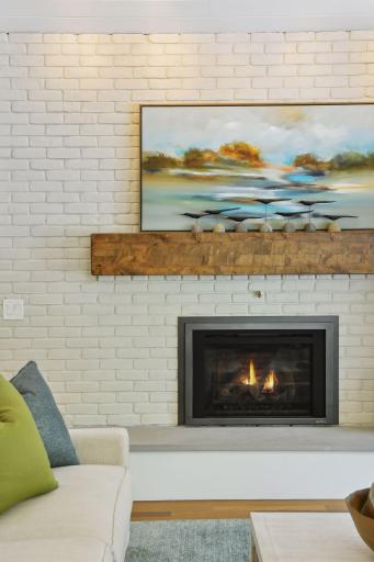 One of 2 gas fireplaces on the main level with a 3rd on the lower level