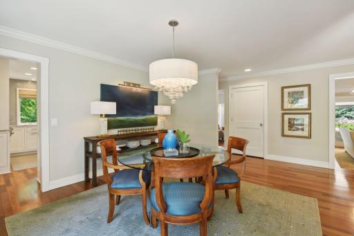 Formal dining connects the kitchen and living room