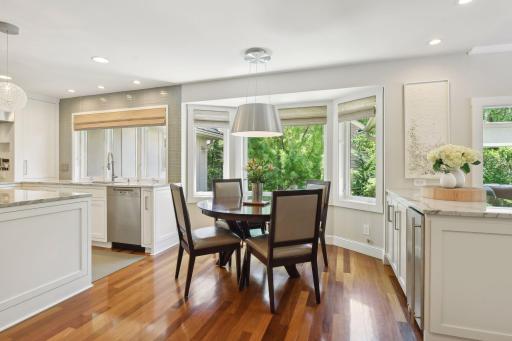 Spacious informal dining area with a built-in buffet and bay windows connects the kitchen and family room, for everyday living and easy entertaining