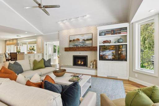 Main level family room features custom cabinetry and a new hearth stone