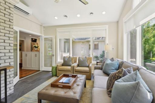 Sun room off the kitchen and family room has been upgraded from a 3 season porch to provide a cozy spot to relax year round