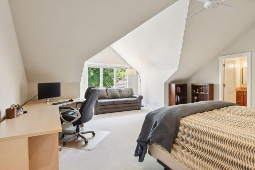 The upper level serves as a private retreat, ideal as a second primary or guest suite, offering both comfort and seclusion