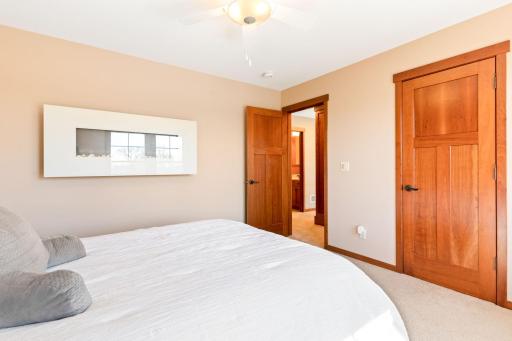 Bedroom 4 with electric fireplace and walk in closet
