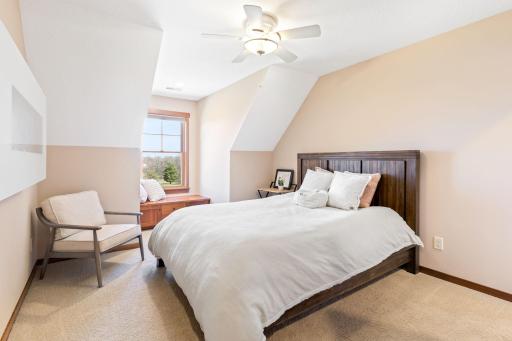 Bedroom 2 with built in bench and electric fireplace