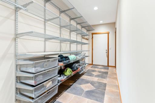 Storage and entrance to second heated/insulated garage, aka Man Cave