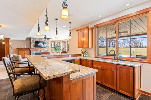 Kitchen area in lower level with pass-through window to patio area