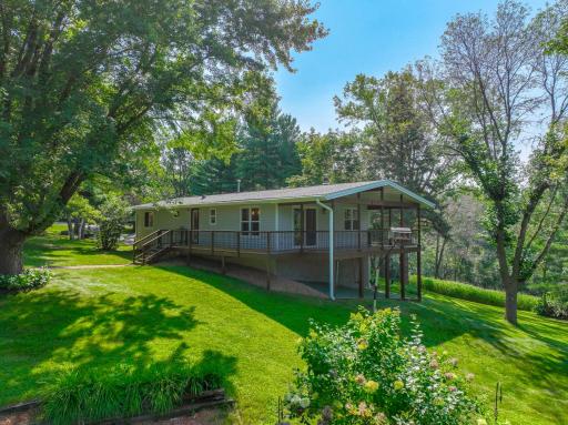 Nestled on 5.5 acres, this stunning home offers the perfect blend of modern amenities & serene outdoor living.